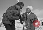 Image of Saint Bernard protecting skiers Garmisch-Partenkirchen Germany, 1965, second 51 stock footage video 65675043210