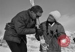 Image of Saint Bernard protecting skiers Garmisch-Partenkirchen Germany, 1965, second 52 stock footage video 65675043210