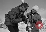 Image of Saint Bernard protecting skiers Garmisch-Partenkirchen Germany, 1965, second 55 stock footage video 65675043210