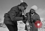 Image of Saint Bernard protecting skiers Garmisch-Partenkirchen Germany, 1965, second 56 stock footage video 65675043210