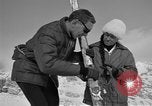 Image of Saint Bernard protecting skiers Garmisch-Partenkirchen Germany, 1965, second 57 stock footage video 65675043210