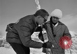 Image of Saint Bernard protecting skiers Garmisch-Partenkirchen Germany, 1965, second 58 stock footage video 65675043210