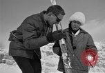 Image of Saint Bernard protecting skiers Garmisch-Partenkirchen Germany, 1965, second 59 stock footage video 65675043210