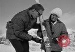 Image of Saint Bernard protecting skiers Garmisch-Partenkirchen Germany, 1965, second 60 stock footage video 65675043210