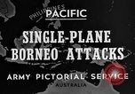 Immagine di B-24 kamikaze attaccano le raffinerie di petrolio e impianti di deposito Labuan Isola Borneo, 1944, secondo 4 filmato di repertorio 65675043293