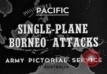 Immagine di B-24 kamikaze attaccano le raffinerie di petrolio e impianti di deposito Labuan Isola Borneo, 1944, secondo 5 filmato di repertorio 65675043293
