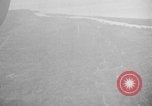 Immagine di B-24 kamikaze attaccano le raffinerie di petrolio e impianti di deposito Labuan Isola Borneo, 1944, secondo 19 filmato di repertorio 65675043293