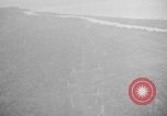 Immagine di B-24 kamikaze attaccano le raffinerie di petrolio e impianti di deposito Labuan Isola Borneo, 1944, secondo 20 filmato di repertorio 65675043293