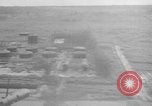 Immagine di B-24 kamikaze attaccano le raffinerie di petrolio e impianti di deposito Labuan Isola Borneo, 1944, secondo 34 filmato di repertorio 65675043293