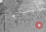 Immagine di B-24 kamikaze attaccano le raffinerie di petrolio e impianti di deposito Labuan Isola Borneo, 1944, secondo 56 filmato di repertorio 65675043293