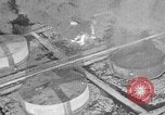 Immagine di B-24 kamikaze attaccano le raffinerie di petrolio e impianti di deposito Labuan Isola Borneo, 1944, secondo 61 filmato di repertorio 65675043293