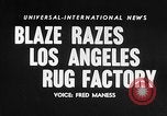 Image of Rug factory on fire Los Angeles California USA, 1955, second 15 stock footage video 65675043377