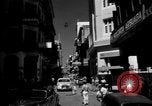 Image of Narrow crowded commercial street Puerto Rico, 1950, second 3 stock footage video 65675043413