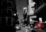 Image of Narrow crowded commercial street Puerto Rico, 1950, second 6 stock footage video 65675043413