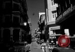 Image of Narrow crowded commercial street Puerto Rico, 1950, second 8 stock footage video 65675043413