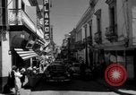 Image of Narrow crowded commercial street Puerto Rico, 1950, second 11 stock footage video 65675043413