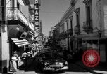 Image of Narrow crowded commercial street Puerto Rico, 1950, second 12 stock footage video 65675043413