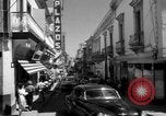 Image of Narrow crowded commercial street Puerto Rico, 1950, second 13 stock footage video 65675043413