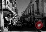 Image of Narrow crowded commercial street Puerto Rico, 1950, second 14 stock footage video 65675043413
