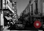 Image of Narrow crowded commercial street Puerto Rico, 1950, second 16 stock footage video 65675043413