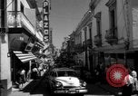 Image of Narrow crowded commercial street Puerto Rico, 1950, second 17 stock footage video 65675043413