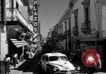 Image of Narrow crowded commercial street Puerto Rico, 1950, second 18 stock footage video 65675043413