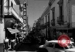 Image of Narrow crowded commercial street Puerto Rico, 1950, second 20 stock footage video 65675043413