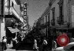 Image of Narrow crowded commercial street Puerto Rico, 1950, second 21 stock footage video 65675043413