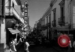 Image of Narrow crowded commercial street Puerto Rico, 1950, second 23 stock footage video 65675043413
