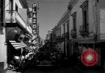 Image of Narrow crowded commercial street Puerto Rico, 1950, second 26 stock footage video 65675043413
