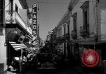 Image of Narrow crowded commercial street Puerto Rico, 1950, second 27 stock footage video 65675043413