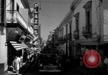 Image of Narrow crowded commercial street Puerto Rico, 1950, second 28 stock footage video 65675043413
