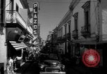 Image of Narrow crowded commercial street Puerto Rico, 1950, second 29 stock footage video 65675043413