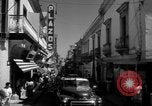 Image of Narrow crowded commercial street Puerto Rico, 1950, second 30 stock footage video 65675043413