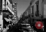 Image of Narrow crowded commercial street Puerto Rico, 1950, second 31 stock footage video 65675043413