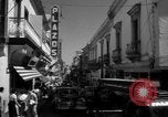 Image of Narrow crowded commercial street Puerto Rico, 1950, second 33 stock footage video 65675043413
