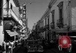 Image of Narrow crowded commercial street Puerto Rico, 1950, second 34 stock footage video 65675043413