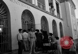 Image of Narrow crowded commercial street Puerto Rico, 1950, second 43 stock footage video 65675043413