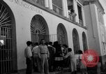 Image of Narrow crowded commercial street Puerto Rico, 1950, second 44 stock footage video 65675043413