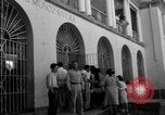 Image of Narrow crowded commercial street Puerto Rico, 1950, second 45 stock footage video 65675043413