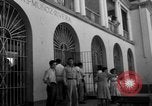 Image of Narrow crowded commercial street Puerto Rico, 1950, second 46 stock footage video 65675043413