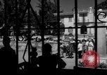 Image of Narrow crowded commercial street Puerto Rico, 1950, second 48 stock footage video 65675043413
