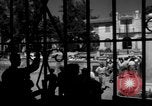 Image of Narrow crowded commercial street Puerto Rico, 1950, second 53 stock footage video 65675043413
