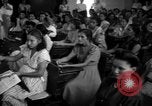 Image of Narrow crowded commercial street Puerto Rico, 1950, second 58 stock footage video 65675043413