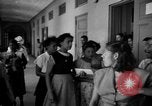 Image of Narrow crowded commercial street Puerto Rico, 1950, second 60 stock footage video 65675043413