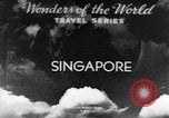 Image of natives in city Singapore, 1937, second 3 stock footage video 65675043495