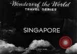 Image of natives in city Singapore, 1937, second 4 stock footage video 65675043495