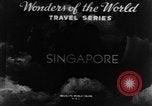 Image of natives in city Singapore, 1937, second 5 stock footage video 65675043495