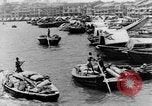 Image of natives in city Singapore, 1937, second 10 stock footage video 65675043495