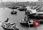 Image of natives in city Singapore, 1937, second 11 stock footage video 65675043495